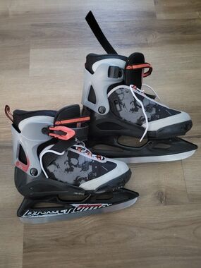 Kids Adjustable Black and Gray Ice Skates with Orange Accents